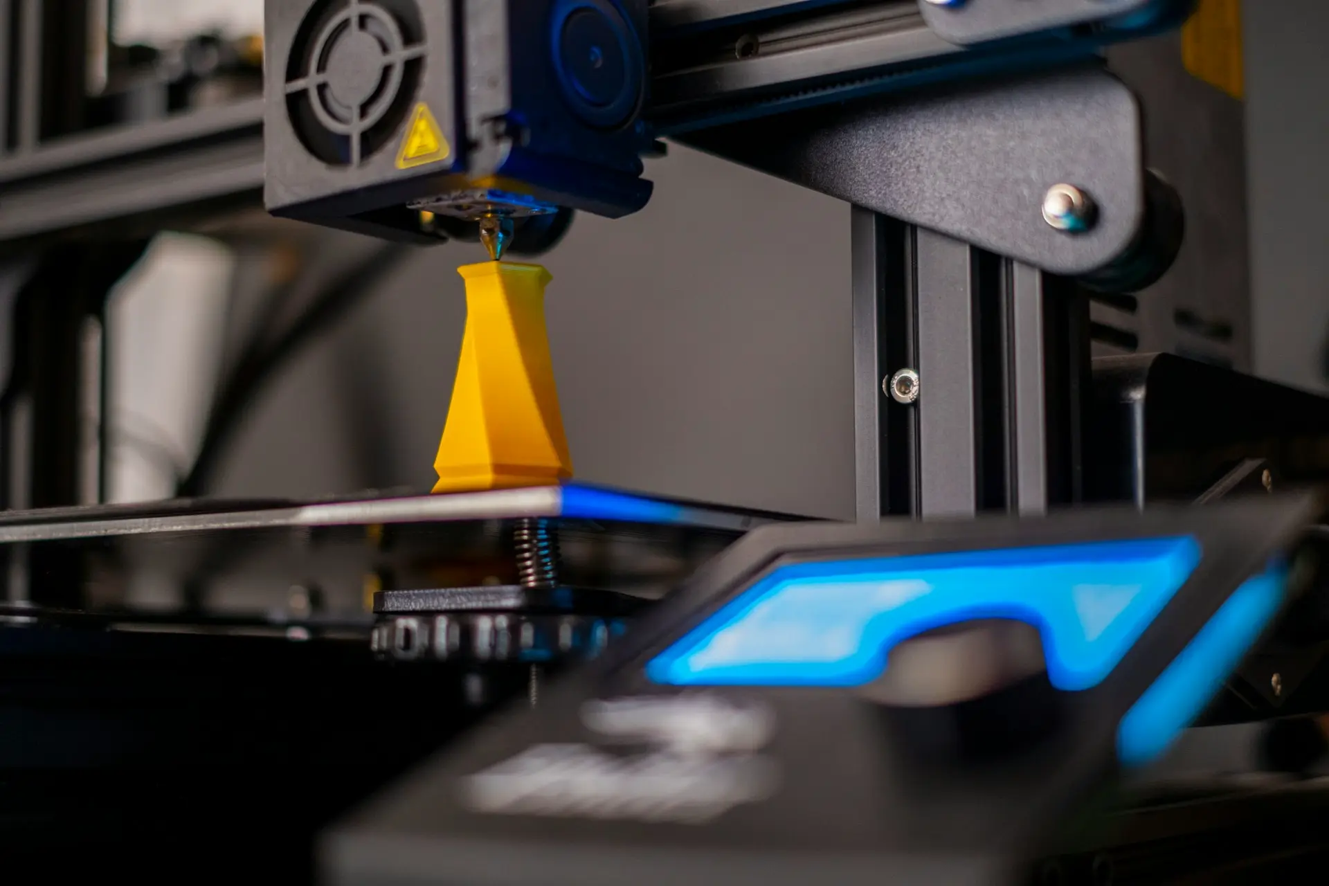 a close up of a machine with a blue light on it