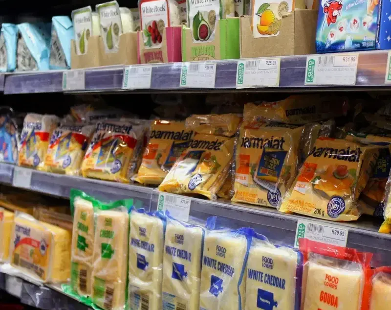 Supermarket with products featuring self-adhesive labels on the shelves