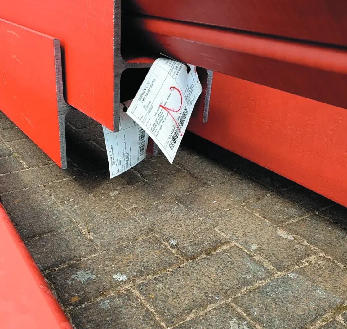 Labels attached to steel beams for outdoor construction